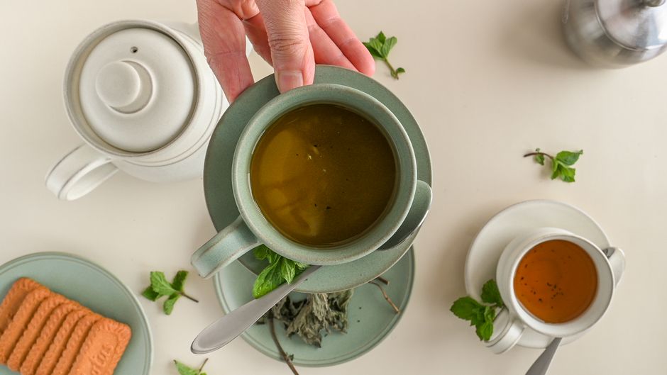 Pomegranate Mint Tea with rosemary sprigs — food · Drinks