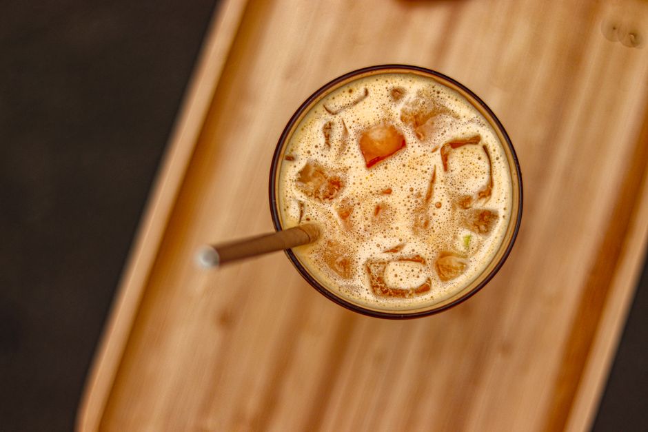 Cardamom Iced Coffee with basil leaves — food · Drinks