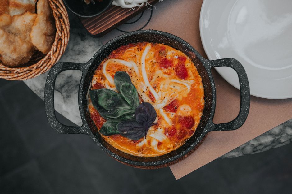 Shakshuka Skillet with a warm fruit topping — food · Breakfast & Brunch