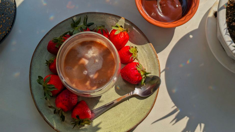 Strawberry Oat Latte with pomegranate seeds — food · Drinks