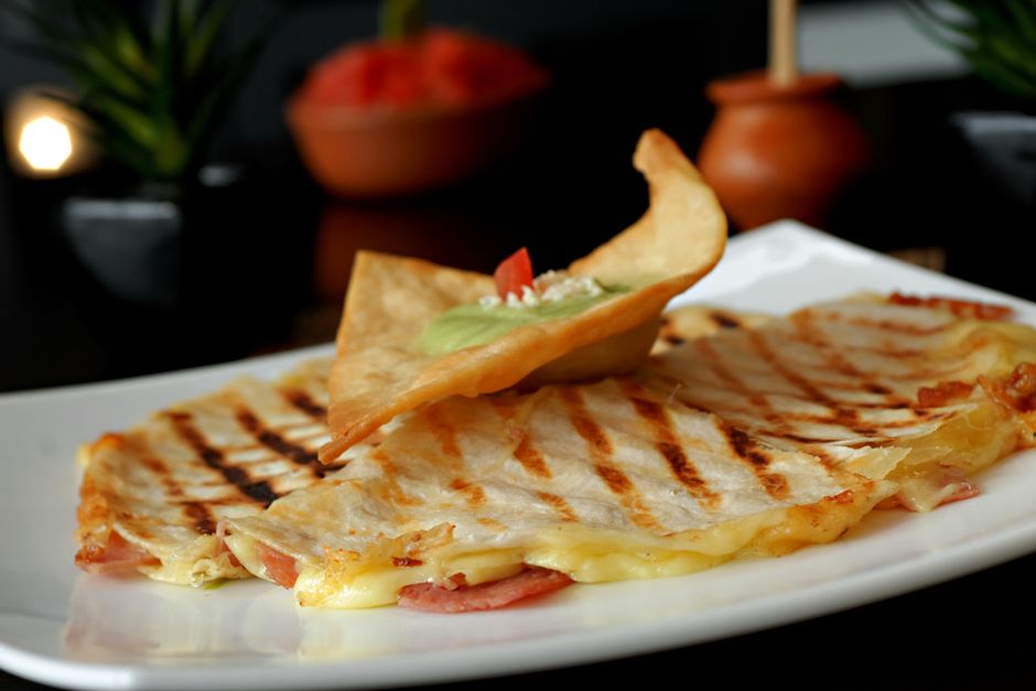 Mini Quesadillas with a colorful garnish — food · Party Food