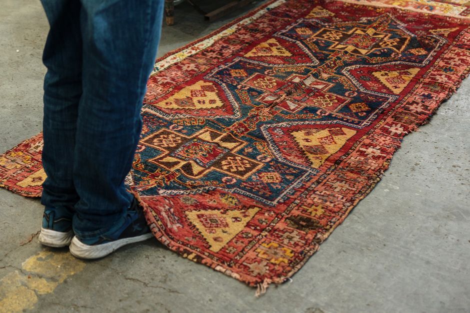 Large Rug using mixed wood tones — home · Living Rooms