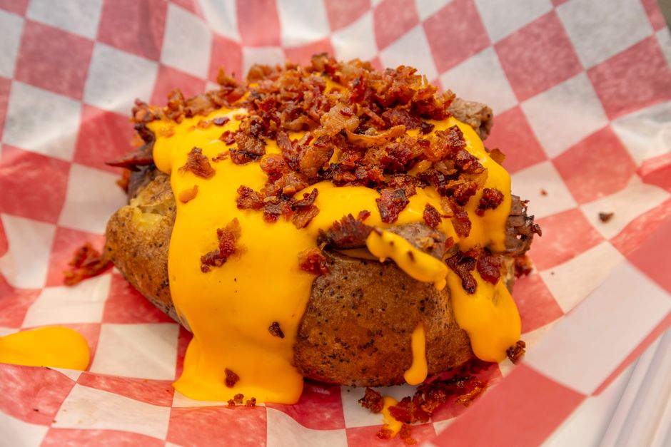 Loaded Potato Bites with a spicy dipping sauce — food · Party Food