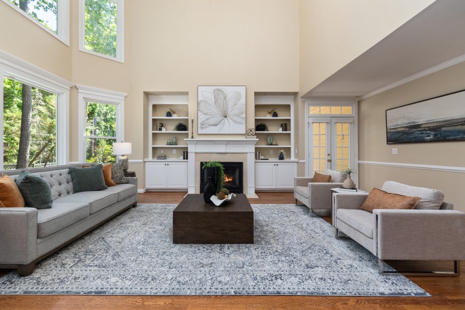 Large Rug using warm neutral tones — home · Living Rooms