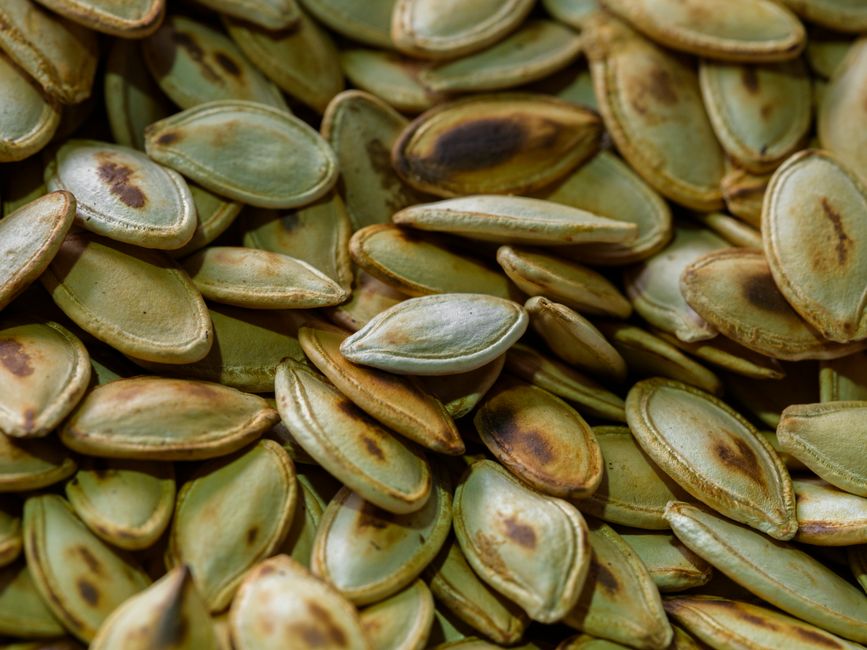Spiced Pumpkin Seeds with tahini drizzle — food · Snacks