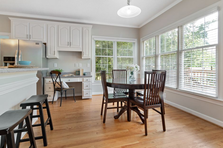 Breakfast Nook using mixed wood tones — home · Kitchens