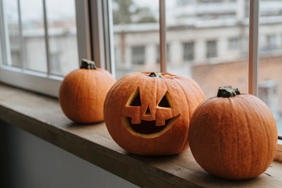 Carved Pumpkin Cluster with a candlelit welcome — celebrations · Halloween