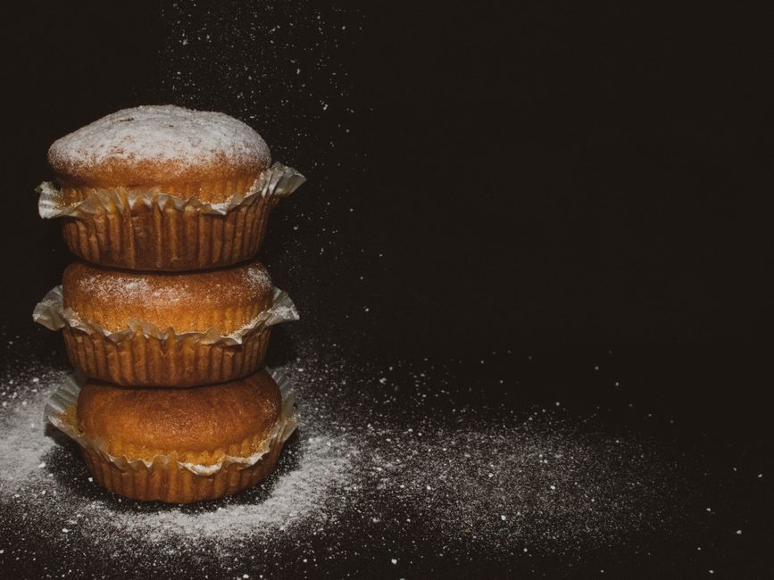 Carrot cake muffins with orange glaze