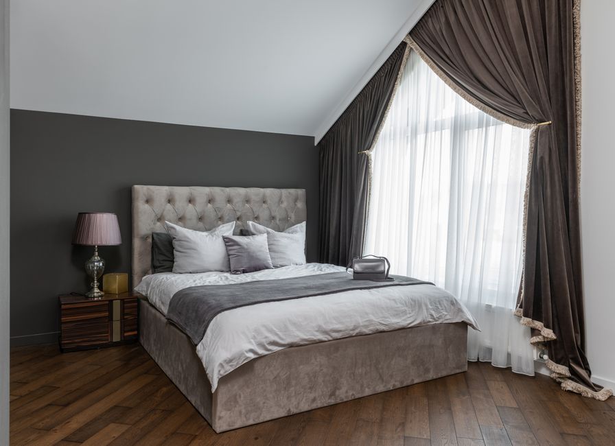 Upholstered Headboard with warm evening lighting — home · Bedrooms