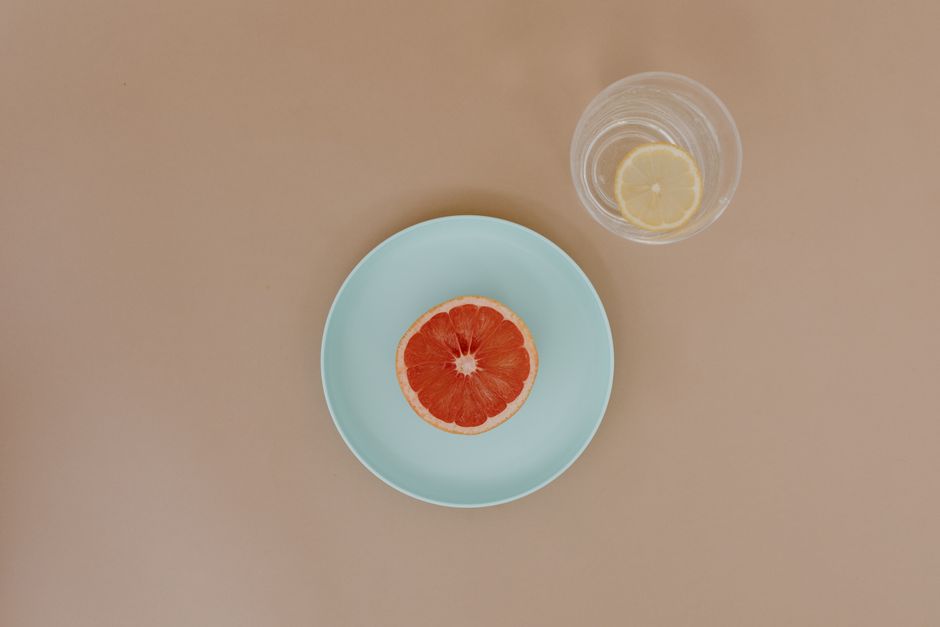 Grapefruit Rosemary Soda with berry ice cubes — food · Drinks