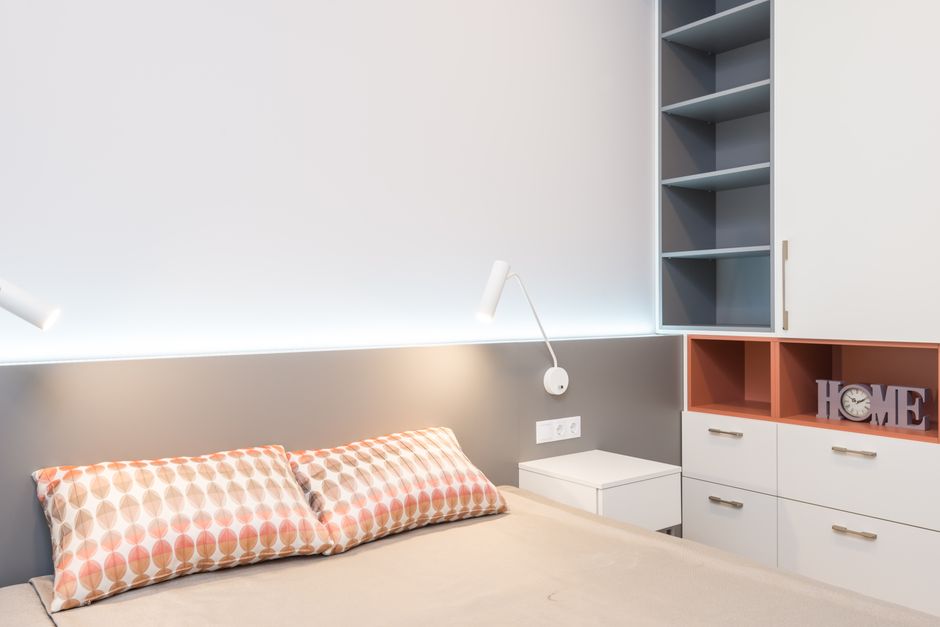 Bedside Sconce using mixed wood tones — home · Bedrooms