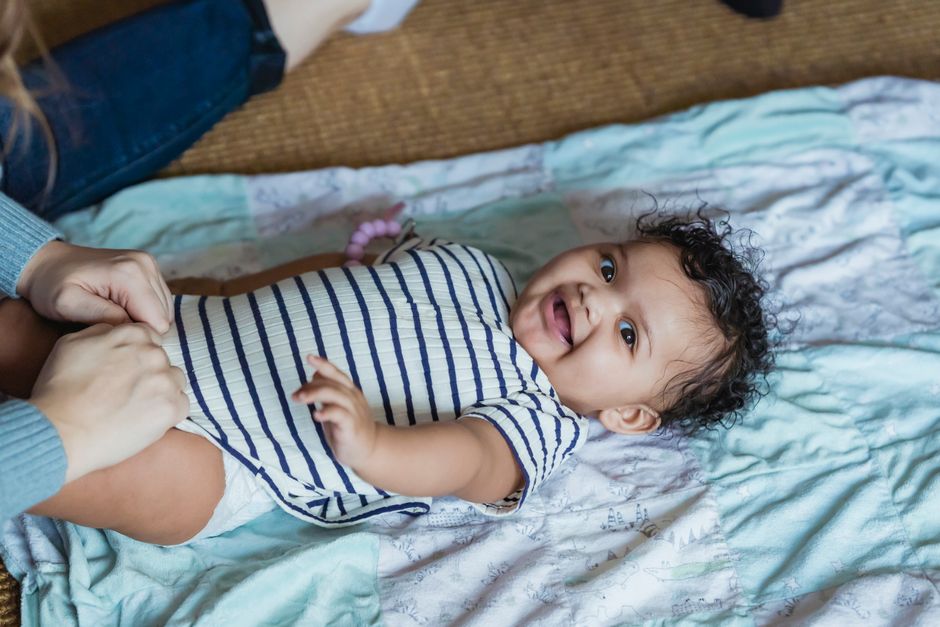 Onesie Decorating Station around a meaningful keepsake — celebrations · Baby Showers