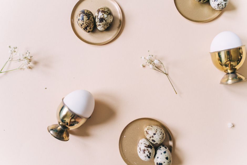 Gold-leaf dipped eggs on a cake stand