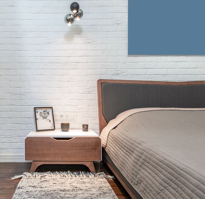 Bedside Sconce with warm evening lighting — home · Bedrooms