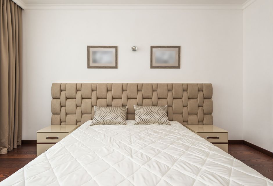 Upholstered Headboard with one sculptural accent — home · Bedrooms