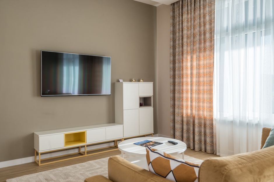 Media Console with one sculptural accent — home · Living Rooms